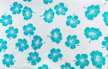 Fototapeta premium Blue hibiscus pattern flower on white paper background, paper with blue flower pattern background