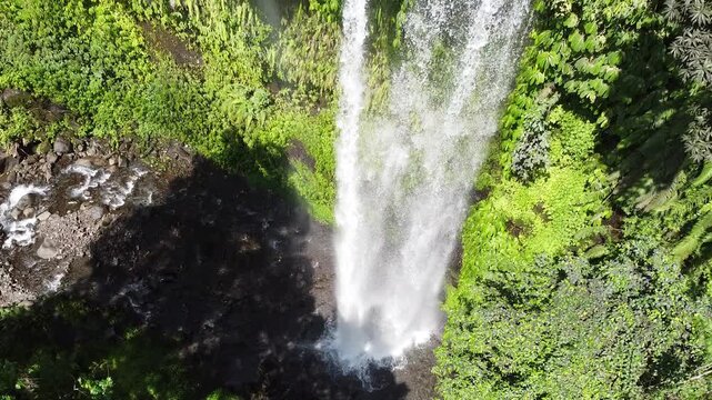 Aerial drone view of the majestic Sendang Gile Waterfall in Lombok, Indonesia