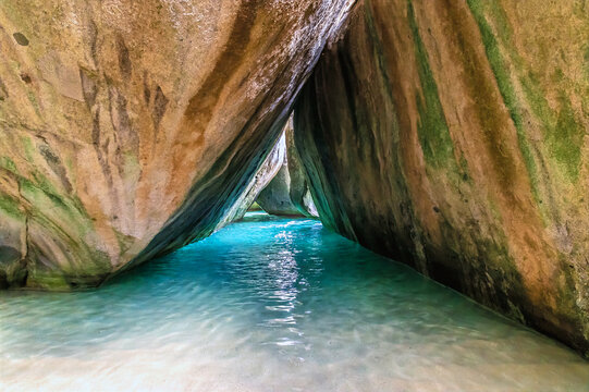 A view along a large enclosed tidal pool in the Baths National Park, Virgin Gorda in the British Virgin islands on a bright morning