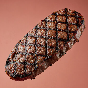 Succulent grilled meat pieces float dynamically