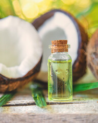 Natural coconut oil in a bottle. Selective focus.