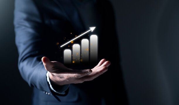Businessman presenting business growth and success graph, highlighting development progress, financial efficiency, and investment strategy to achieve future industry goals and opportunities.