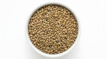 Obraz premium A bowl of brown lentils on a white background