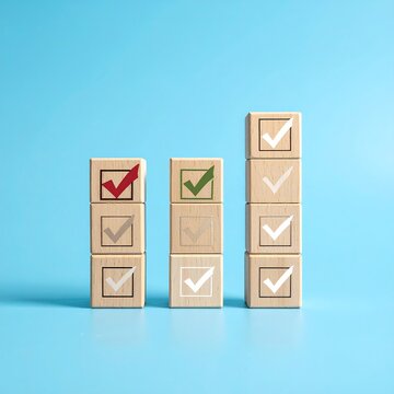 Three columns of wooden blocks, each with a check mark symbol, some colored and some transparent, on a bright blue background