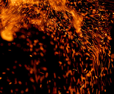 A black background with orange sparks