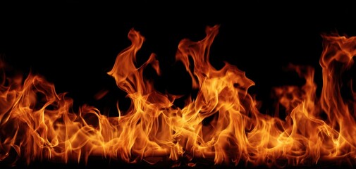 Fototapeta premium The Flames Danced Across A Dark Background Creating An Intense Fiery Abstract Scene