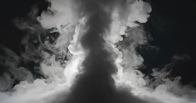 Dramatic smoke explosion in darkness.