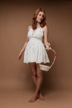 Easter Girl in White Dress Holding Basket