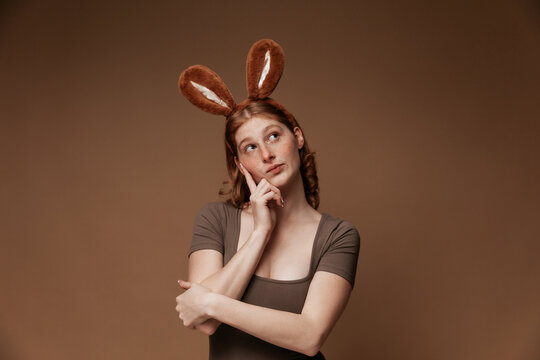 Thoughtful Easter Bunny Girl with Basket
