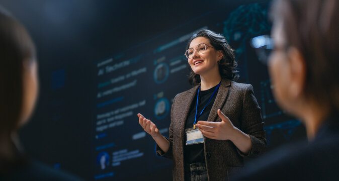 Confident Female Speaker Giving Innovative Technology Presentation at Conference