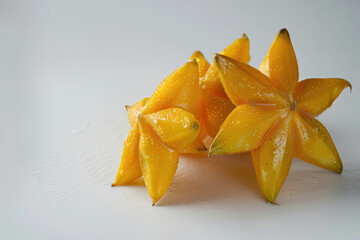 Fototapeta premium Star fruits on a white background, photographed in high definition. Photos for supermarket posters