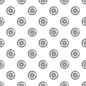 Outline drawing of car wheels forming a repeating seamless pattern