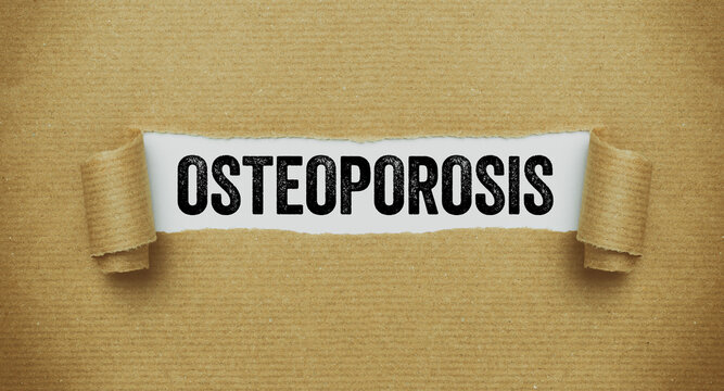 Torn paper revealing the word Osteoporosis