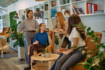 Fototapeta premium Diverse women collaborating during an informal office meeting