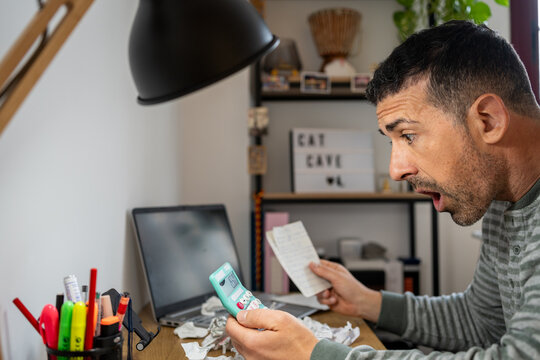 Entrepreneur calculating bills facing economic crisis stress