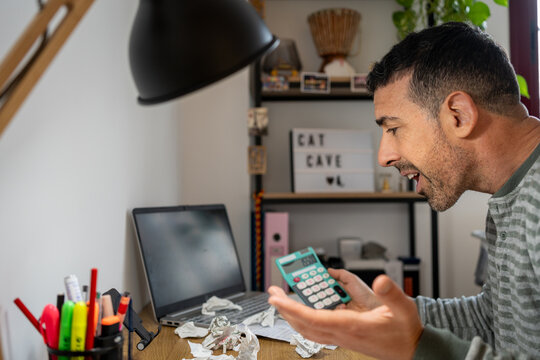 Entrepreneur struggling with finances and debt at home office