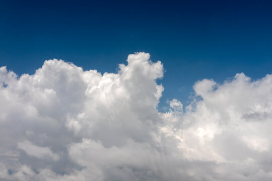 Himalayas, clouds against blue sky