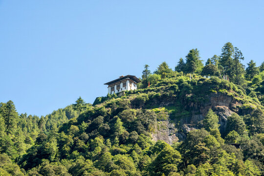 Paro Bhutan, traditional building on mountain ridge
