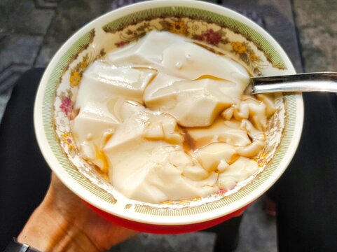 Wedang tahu is a traditional Indonesian-Javanese warm dessert consisting of silky, soft soy pudding or tofu served in a sweet, aromatic ginger palm sugar syrup.