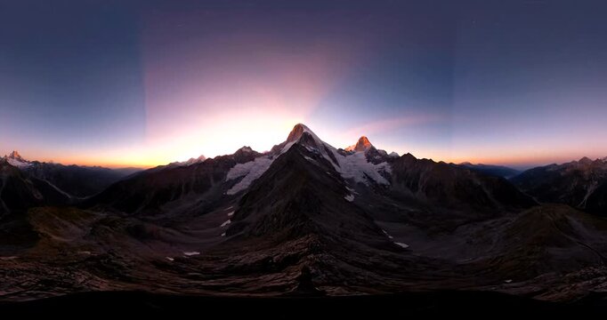 Stunning 360degree panoramic view of majestic snowcapped mountains at sunrise.