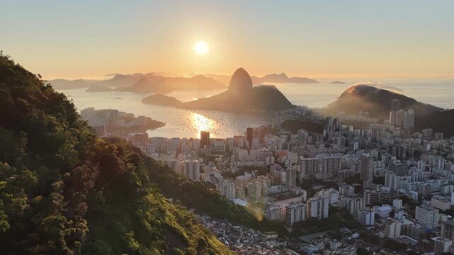 Sunset Sugarloaf Mountain In Rio De Janeiro Brazil. Stunning Tropical Coastline Beach Scene Viewed From Above. Sunrise Clouds Sky Beach. Sunrise International Beach Panning Wide.