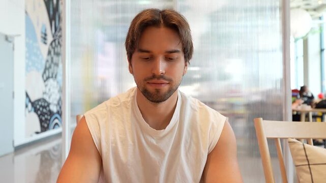 A man drinking ice coffee