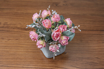 Tiny decoration with a plastic cactus-like plant, with simulated rubber spines, and a resin pot painted with a terracotta effect © Toyakisfoto.photos