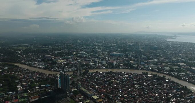 Drone view of residential area in Davao City. Houses in riverside. Mindanao, Philippines.
