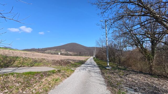 Grassy path winds through quiet countryside. Lazarev (Lazar's) Canyon. Balkans, Serbia.