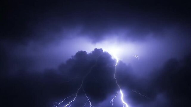 A bright bolt of lightning strikes through the dark night sky during a storm