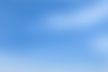 Obraz premium Soft blue background with a smooth gradient texture. The blue background creates a calming and serene atmosphere. Aesthetic gradient blue background with copy space.