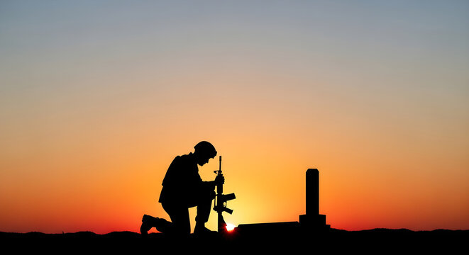 Touching memorial day images silhouette of soldier at sunset honoring fallen heroes