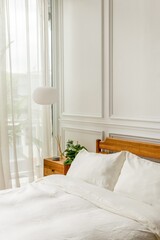 Serene bedroom with natural light. © Rawpixel.com