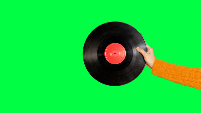 Hand holding vintage vinyl record
