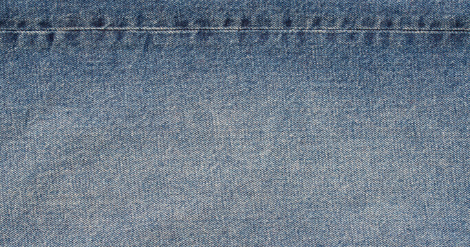 light blue beige denim fabric texture with horizontal seam stitch detail