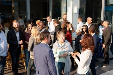 Obraz premium Diverse group networking outdoors photo