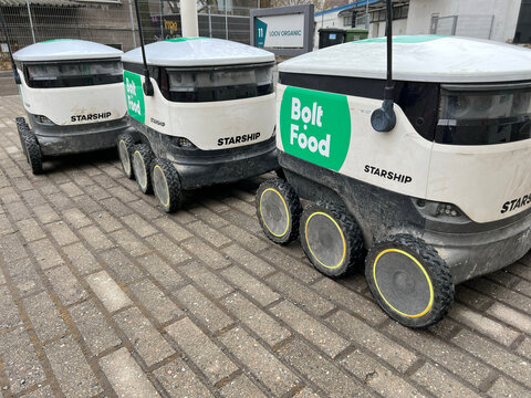 Autonomous Bolt Food delivery robots parked on Tallinn, Estonia - April 4, 2026. Last-mile food delivery technology, urban mobility, and futuristic logistics for business and advertising use.