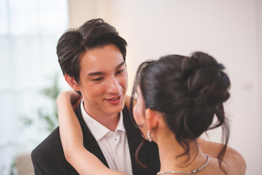 Close up of romantic wedding couple looking at each other eyes with love
