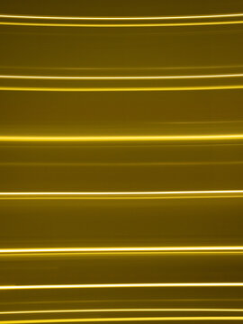 Golden light painting lines forming abstract pattern