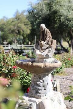 Chumash Indian woman sculpture in the garden of Santa Ines mission