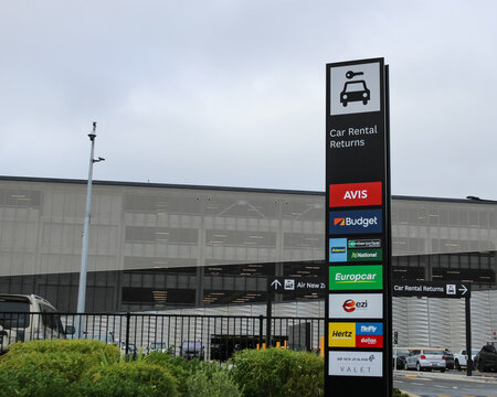 Auckland, New Zealand - March 12, 2026: A car rental return sign for the airport, listing several rental companies. Editorial Use Only.