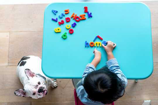 Child learning with colorful letters.