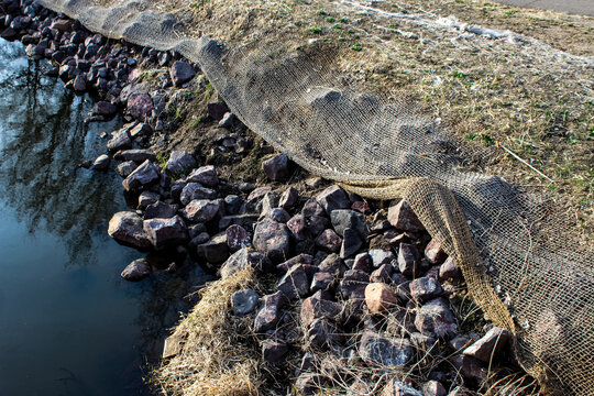 a shoreline restoration project involving erosion control measures along a watershed area. environment background