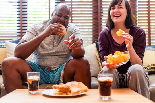 Friends enjoying snacks together.