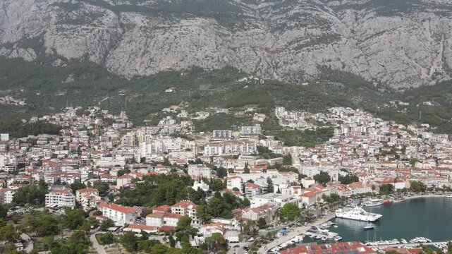 Makarska, Croatia. Coastal town, sea and mountains, Aerial photography from a drone. Croatian town on the Adriatic Sea. Makarska Riviera