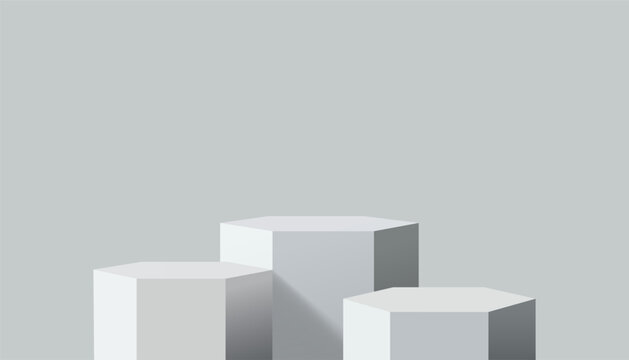 Three Hexagonal Podium Stands of Varying Heights on a Neutral Gray Background with Subtle Shading and Depth
