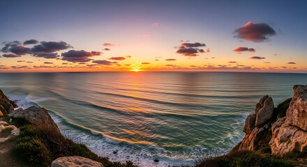 Obraz premium Ocean Sunset Panorama - Serene Coastal Landscape at Dusk.