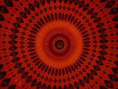 red calligraphy of asmaul husna at mosque dome