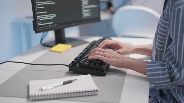Close-up hand typing on keyboard IT tech team support customer service programmer software developer coding network website application engineer, remote working from home online indoor office concept