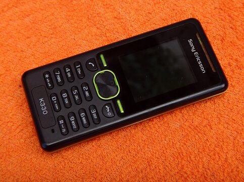 Sony Ericsson K330 vintage candybar phone on orange towel